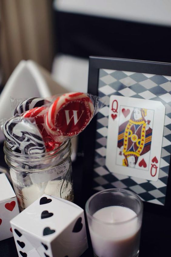 Casino Wedding table decorations. Do a Queen and a King of Hearts or Diamonds for the Bride and Groom. Then the Number cards for the table numbers.